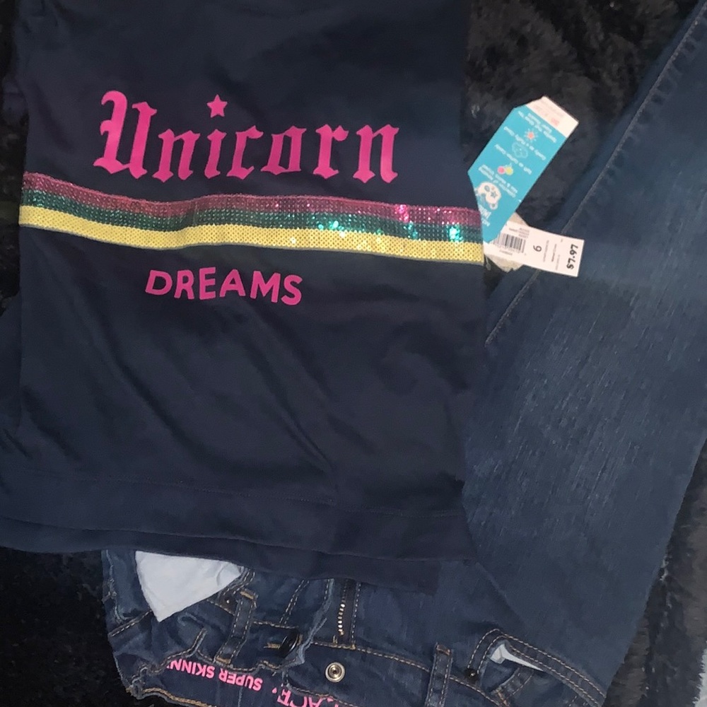 Children place jeans with unicorn shirt